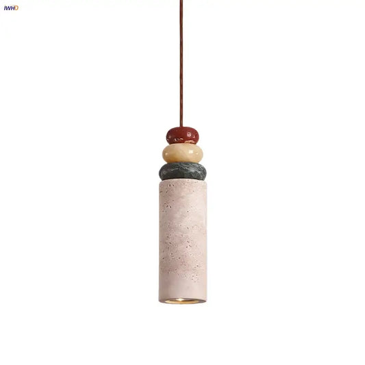 Modern pendant light with a beige concrete cylinder topped by colorful stone led in red yellowish beige and dark gray for dining room decorbites colorful stone