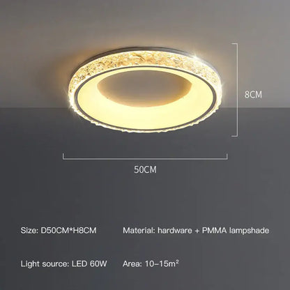 Modern concave round ceiling light with metallic frame and faceted crystal elements emitting warm yellow glow by decorbites