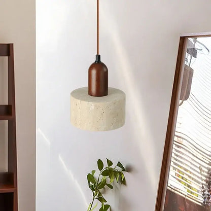 Minimalist pendant light with cylindrical concrete base, warm brown wood top, and copper cord for modern decorbites led yellow travertine