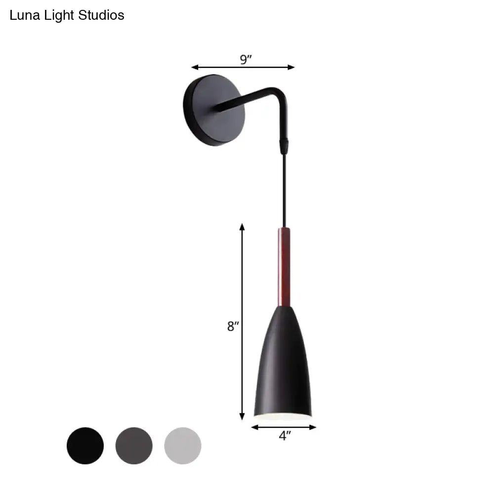 Modern conical black wall lamp with black matte finish curved arm and red accent rod 1 inch fixture for bedroom use