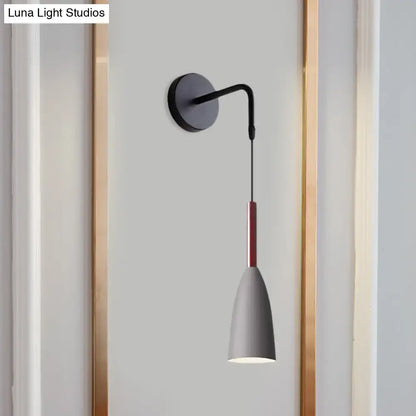 Modern conical black wall lamp with matte black base, curved arm, and gray shade with red stripe 8 inch fixture