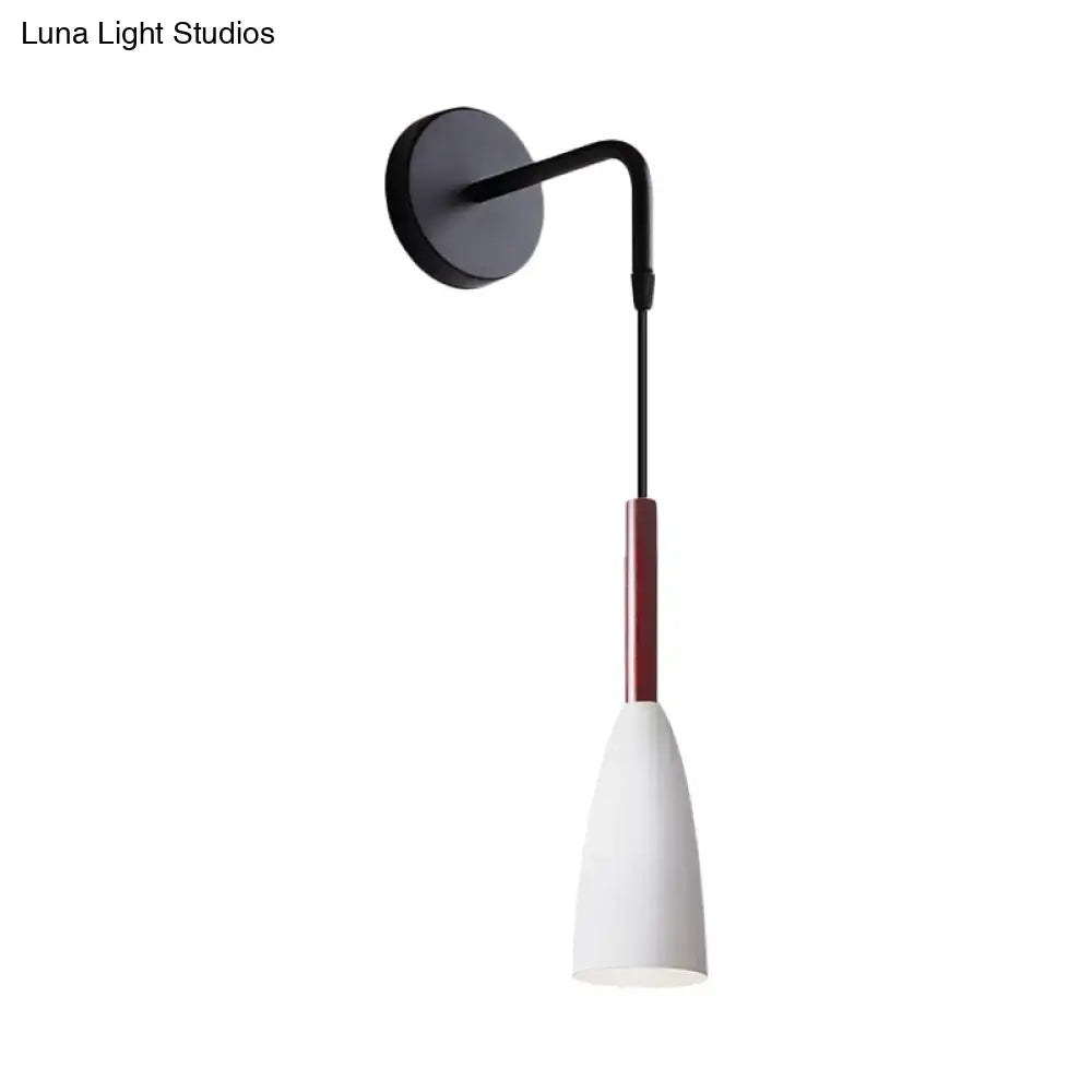 Modern conical black wall lamp with a slender curved arm and red accent sleeve inch fixture for bedroom use