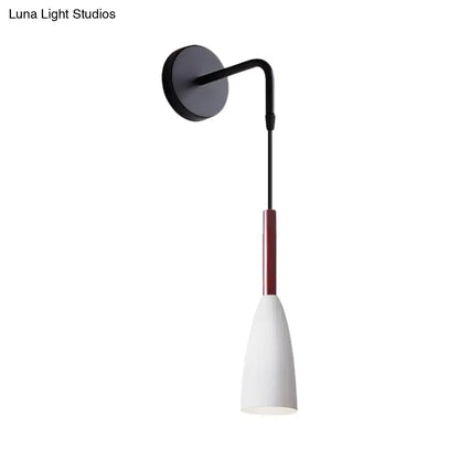 Modern conical black wall lamp with a slender curved arm and red accent sleeve inch fixture for bedroom use