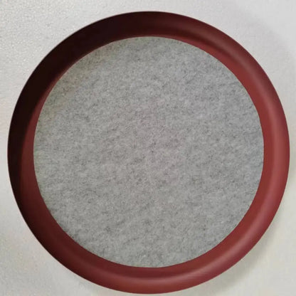 Circular red-framed mirror with gray textured fabric backing shown alongside modern copper and black decorbites grid led pendant light