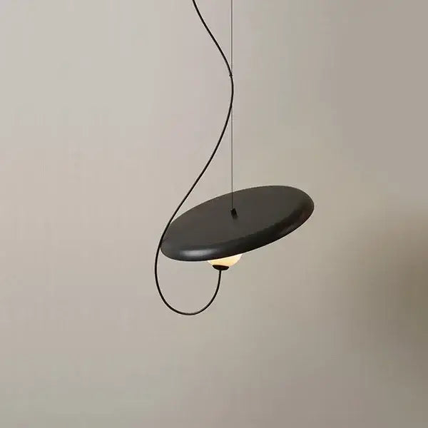 Black matte circular pendant light with sleek curved cord for modern copper and black decorbites grid led pendant use