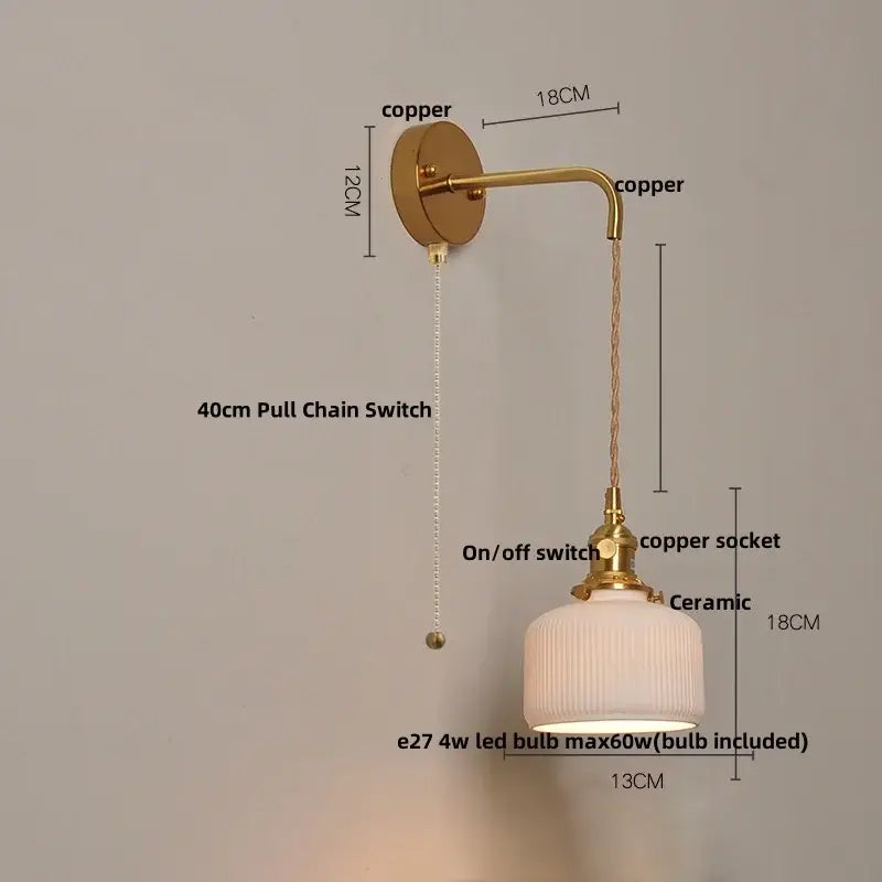 Modern copper wall light fixture with off-white ribbed ceramic shade and pull chain switch for bedroom use