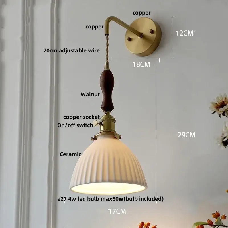 Vintage-style wall light fixture with copper mount, adjustable wire, dark walnut handle, brass socket, and off-white lampshade