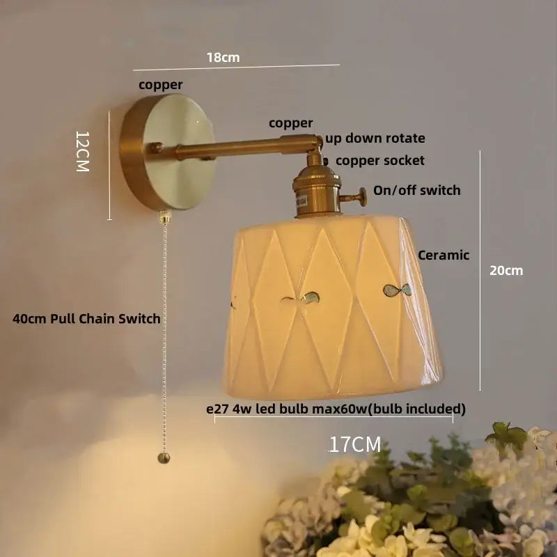 Modern copper and off-white ribbed wall light fixture with ceramic geometric shade and decorative cutouts for bedroom use