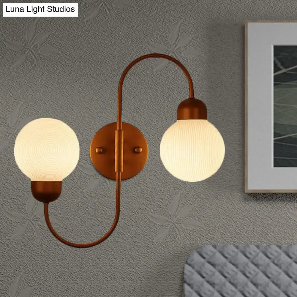 Modern copper spherical wall sconce with frosted white glass shades for living room lighting