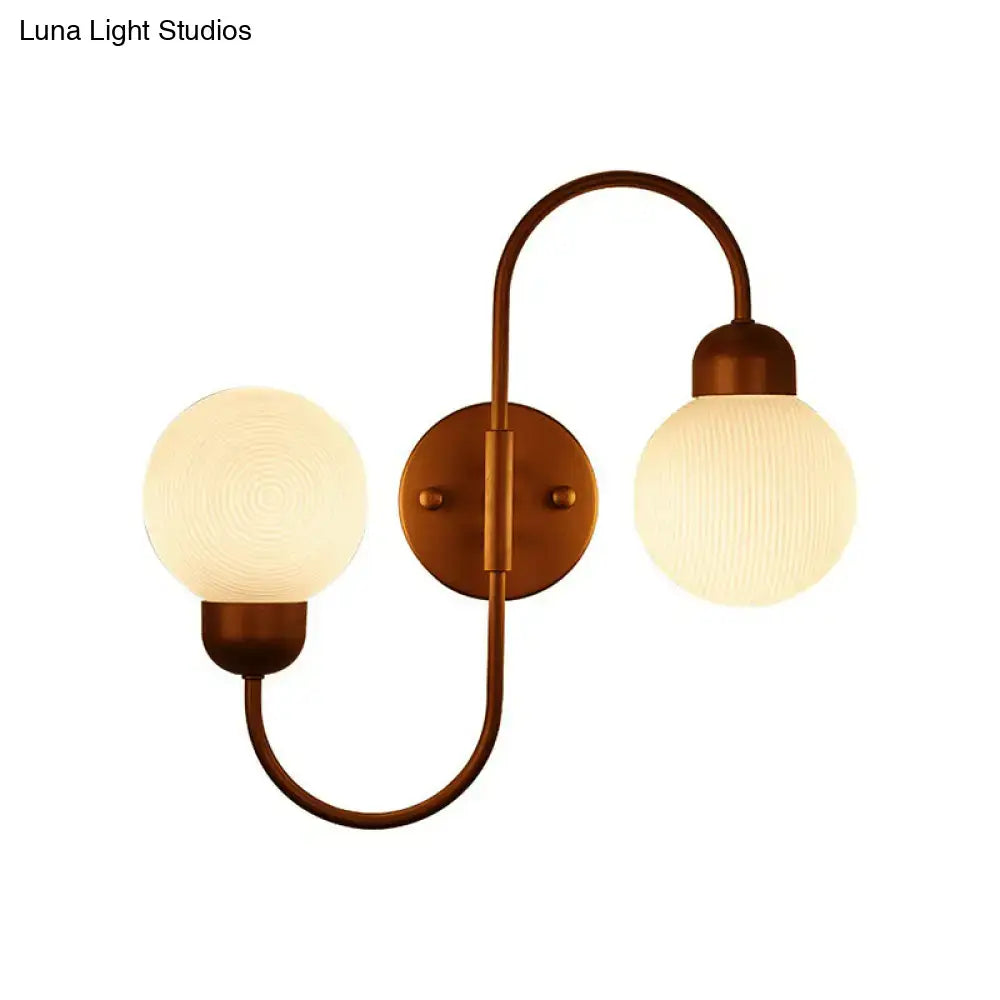Antique brass double-arm living room spherical wall sconce with modern white frosted glass globe shades