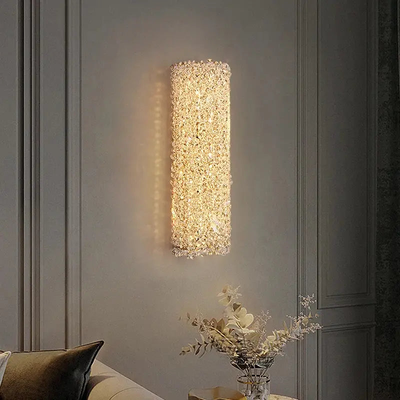 Modern copper crystal wall sconce with clear sparkling crystals emitting warm golden glow for living room decorbites crystal wall lighting