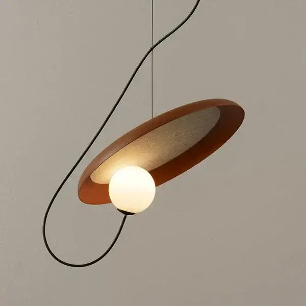 Modern copper decorbites grid color pendant light with warm matte circular shade and glowing bulb for dining room use