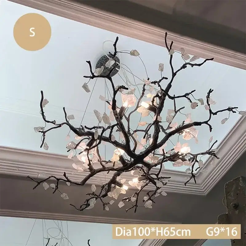 Modern copper led branch chandelier featuring dark textured arms and translucent pinkish-white crystal leaves for dining room decorbites copper led lighting