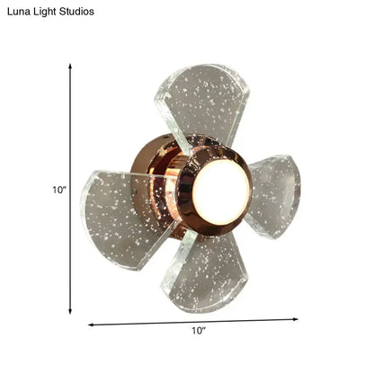 A modern 10-inch ceiling fan with copper motor housing and acrylic blades featuring speckles, emphasizing maximum bulb wattage
