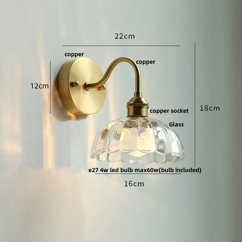 Antique brass-finished copper wall sconce with faceted decorbites clear glass shade and bedroom pull chain light