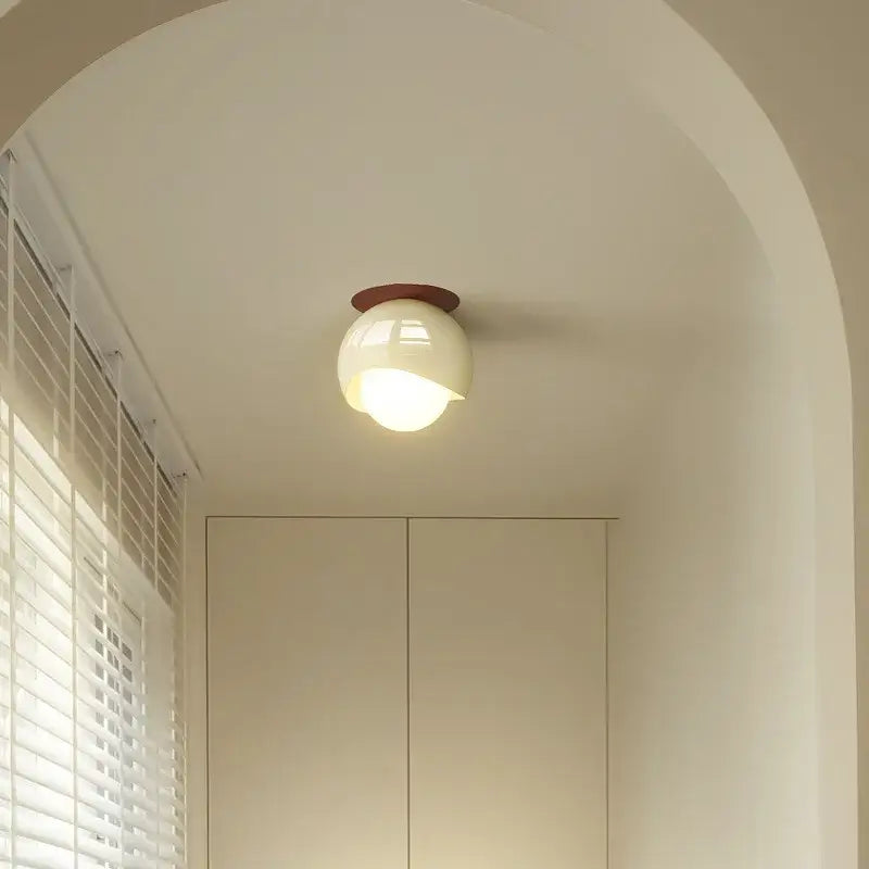 A sleek cream and brown glass iron led ceiling lamp with a warm glow for modern bedroom decorbites glass iron lighting