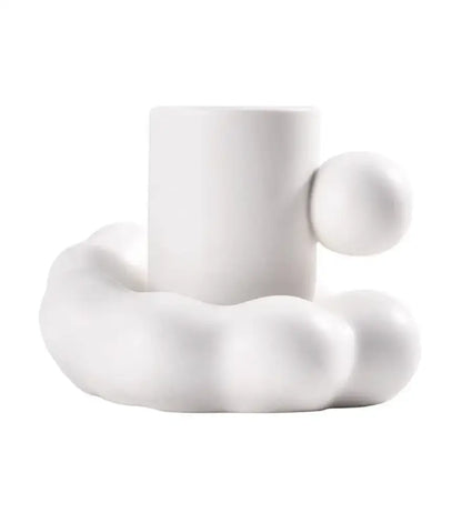 Modern cream ceramic cup and saucer set with a cloud-like base and rounded handle for elegant decorbites cotton candy use