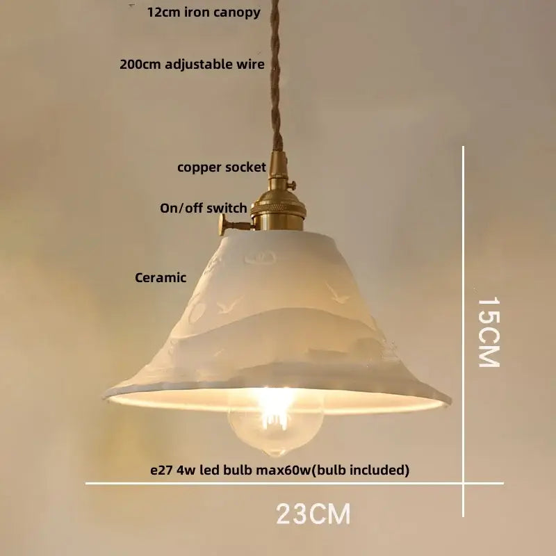 Modern cream ceramic led pendant light with subtle bird motifs brass accent and adjustable wire suspension decorbites ceramic led