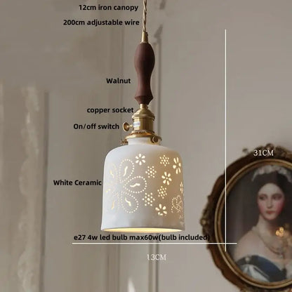 Modern cream ceramic led pendant light with floral cutouts walnut handle and brass accents by decorbites ceramic led pendant