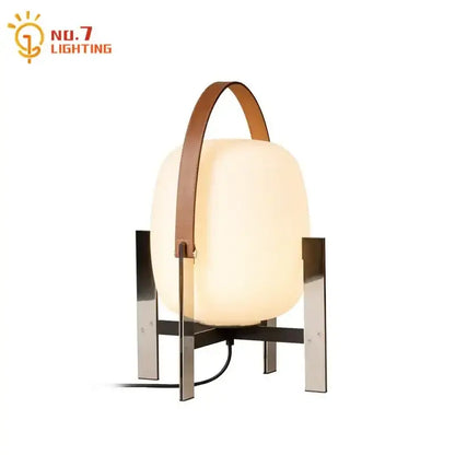 Modern cream designer metal glass table lamp with frosted finish and brown leather handle by no.7 lighting for bedroom decorbites designer metal