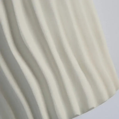 Modern cream ridged ceramic double led wall lamp with soft cream pleated fabric features gentle flowing folds