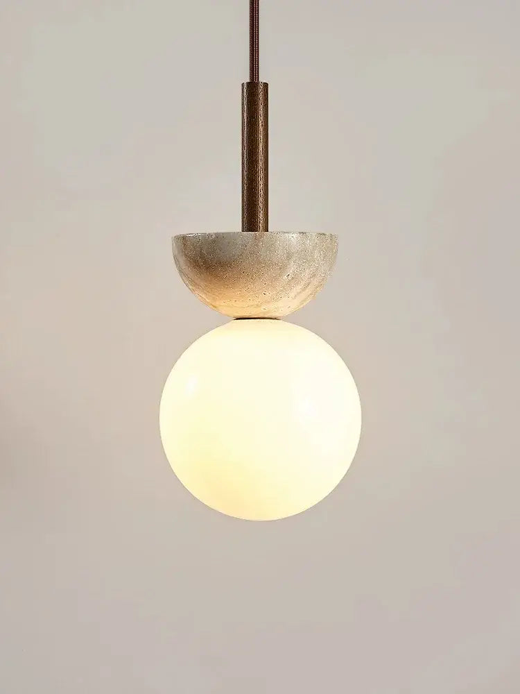 Modern cream style led pendant lamp with matte bronze stem, textured concrete half-sphere, and opal glass globe