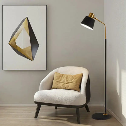 Cream-colored upholstered armchair with dark wood legs and mustard-yellow cushion beside DecorBites™ black floor lamp