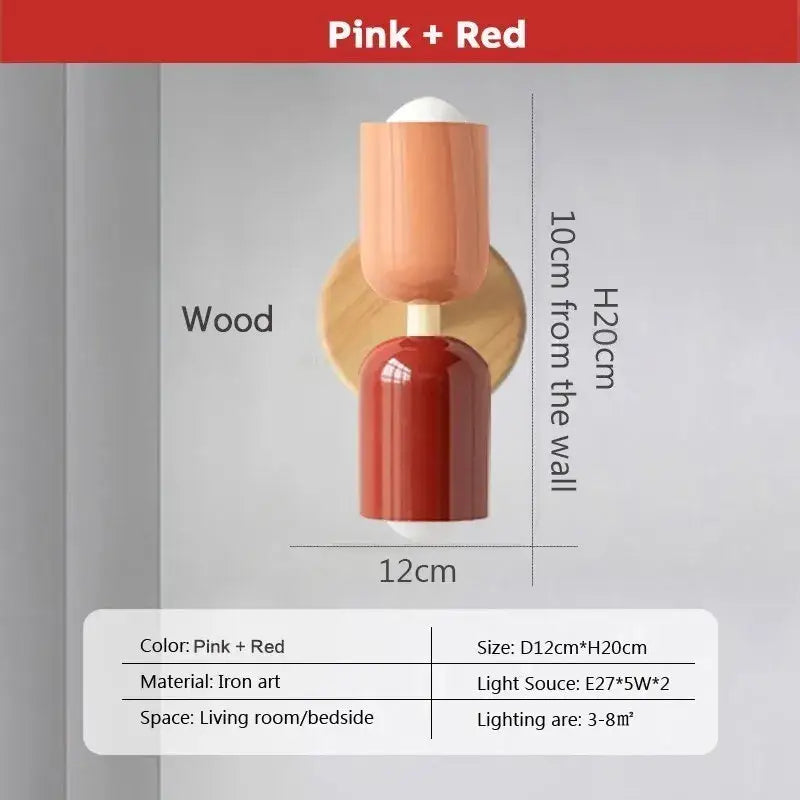 Modern cream zipper wooden wall lamp with wooden base and pink and red cylindrical shades for bedroom illumination