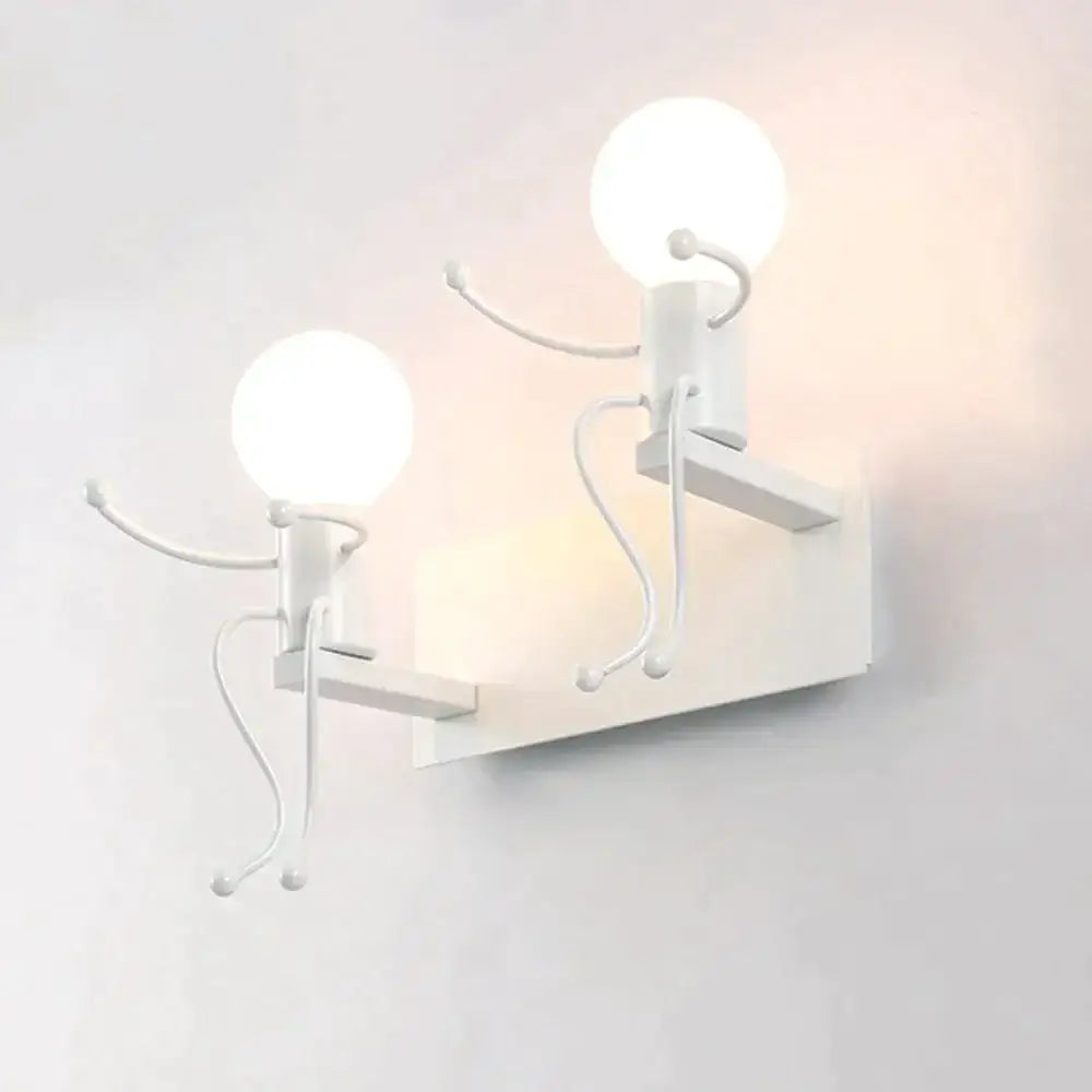 White minimalist wall sconce with two creative minimalism metal robot figures featuring spherical bulb heads for bedroom use