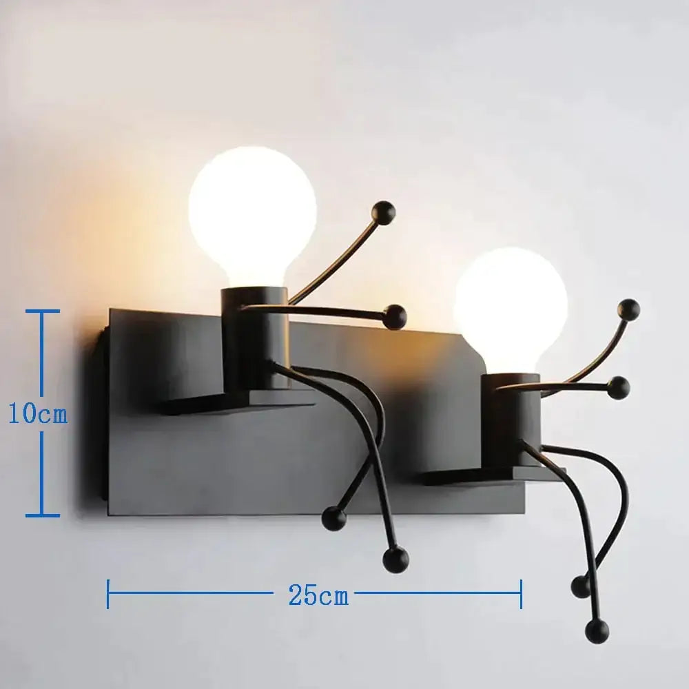 Black metal wall sconce with two exposed bulbs and articulated arms featuring spherical beads in modern creative minimalism style