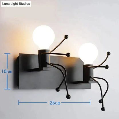 Black metal wall sconce with two exposed bulbs and articulated arms showcasing modern creative minimalism design