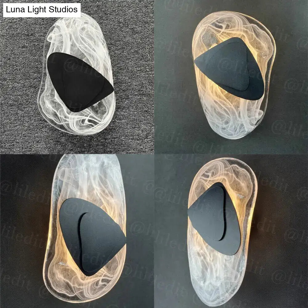 Modern creative minimalist glass wall lamp featuring transparent sculpted sconce with swirling patterns and black accent