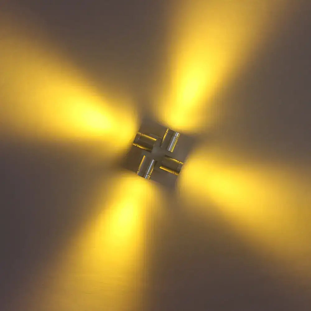 Modern cross aluminum wall mount lamp with four arms and warm yellow light in silver brushed finish for bedroom use