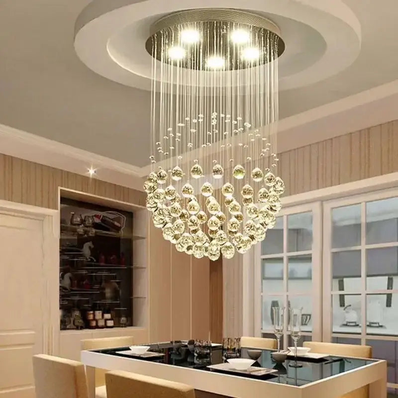 A modern decorbites crystal ball ceiling chandelier with cascading clear glass spheres and sleek metallic frame