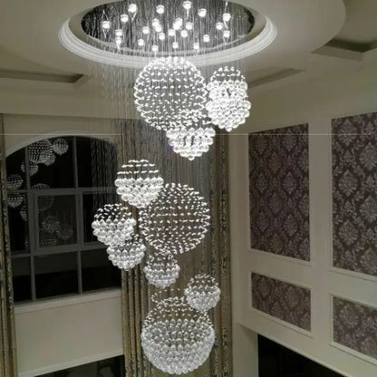 Modern crystal ball led chandelier with clear faceted crystal clusters suspended by chains for elegant living room decorbites decor