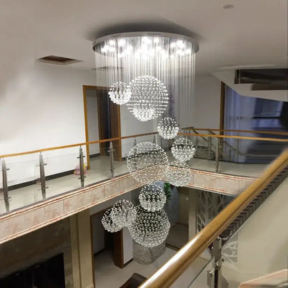 Modern crystal ball led chandelier with multi-tiered clear glass bead clusters on a circular metallic frame for living rooms