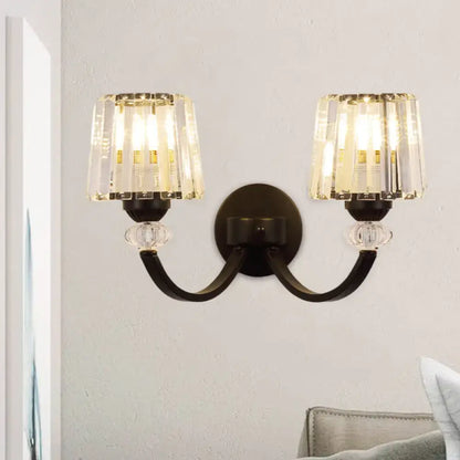 Modern wall lamp black gold with curved arms and cylindrical crystal shades for wall mounted bedroom lighting