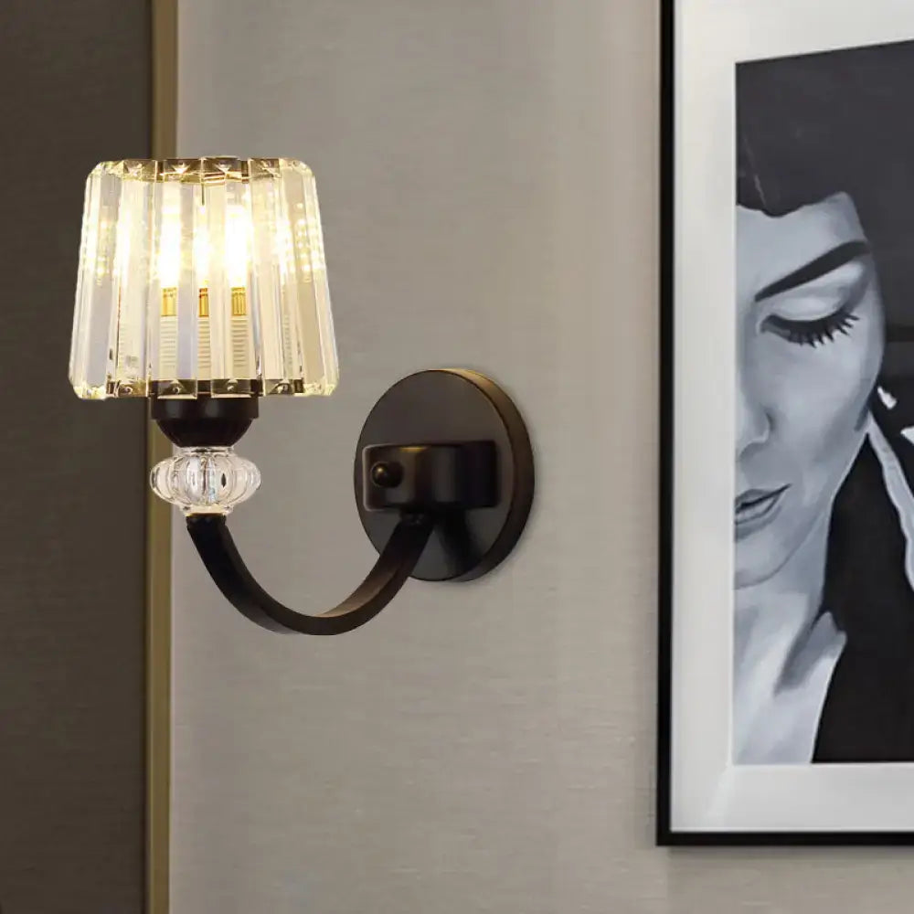 Elegant modern crystal black gold wall lamp with dark bronze finish curved arm and vertical glass prisms for bedroom lighting