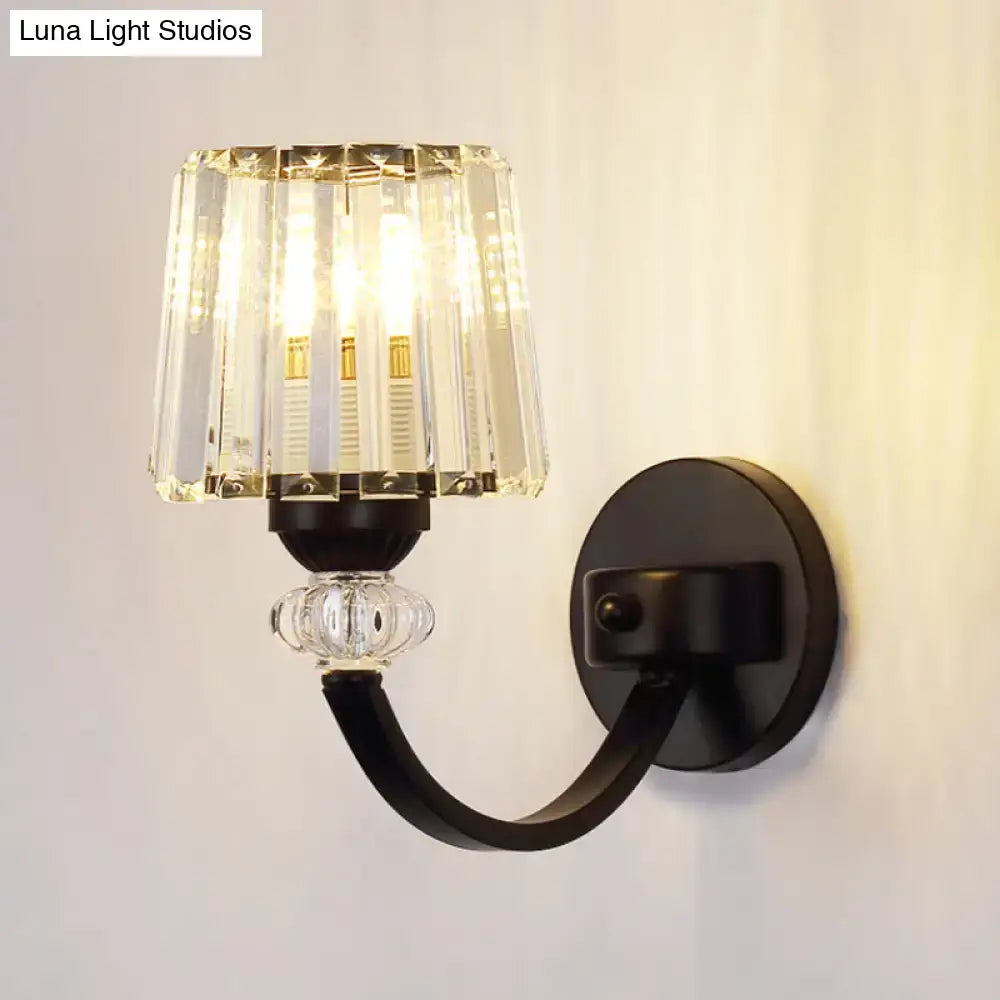 Elegant modern black gold wall lamp with curved arm featuring faceted crystal shade and decorative glass bead