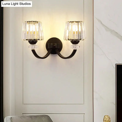 Elegant modern black gold wall lamp with two crystal encased light fixtures and curved arm wall mounted design