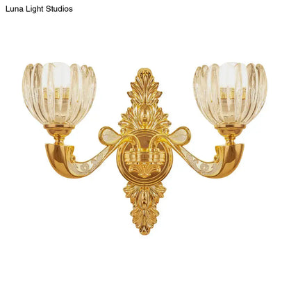 Gold-finished ornate block gold wall lamp fixture with two fluted glass shades for modern bedroom sconce lighting