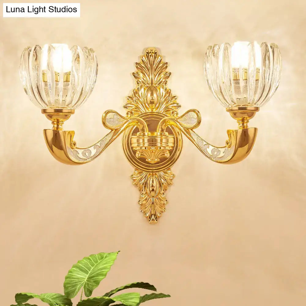 Gold-toned crystal block gold wall lamp fixture with two fluted glass shades for modern bedroom sconce lighting