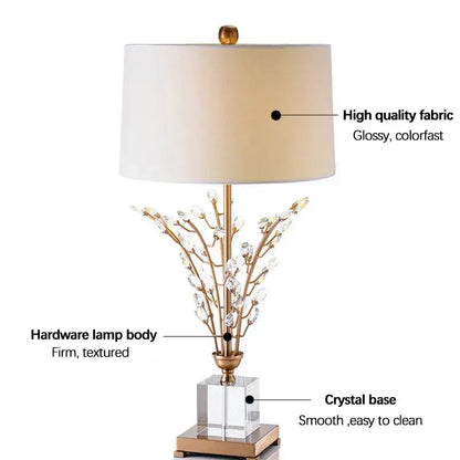 Elegant gold-toned decorbites crystal branch table lamp with cream fabric shade and clear acrylic base for bedroom decor