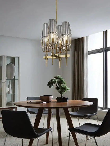 Modern crystal brass glass pendant light featuring brass and clear glass with multiple cylindrical shades for dining room decorbites crystal brass chandelier