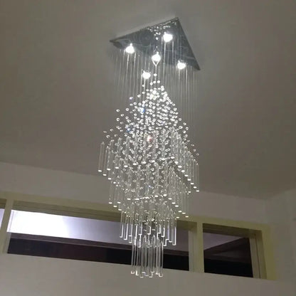 Modern crystal column chandelier with sleek triangular metal mount and cascading clear glass beads decorbites crystal column