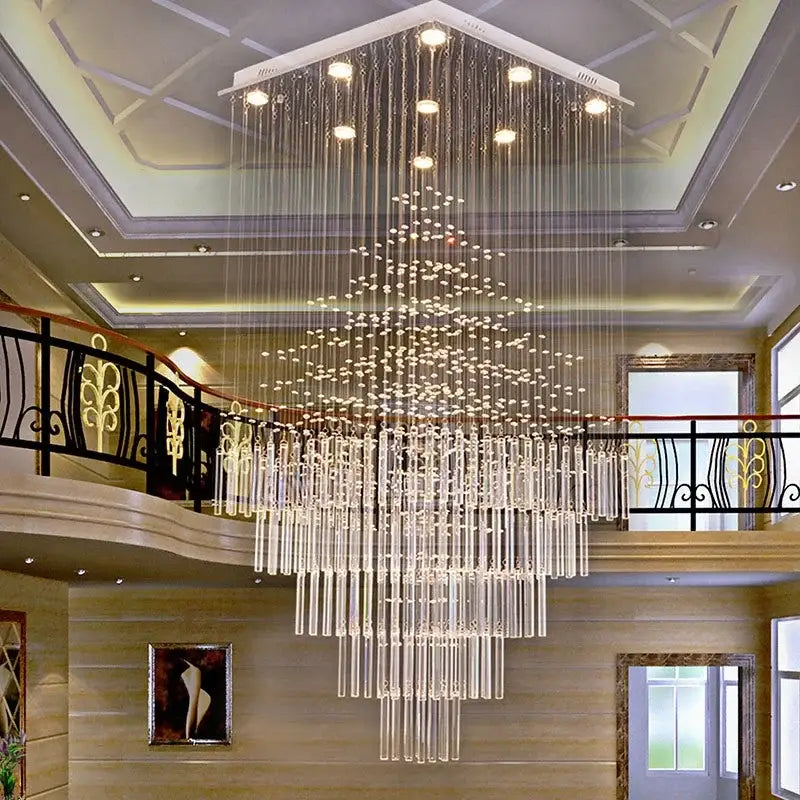 A modern decorbites crystal column chandelier with tiered clear glass rods and embedded lights for living room decor