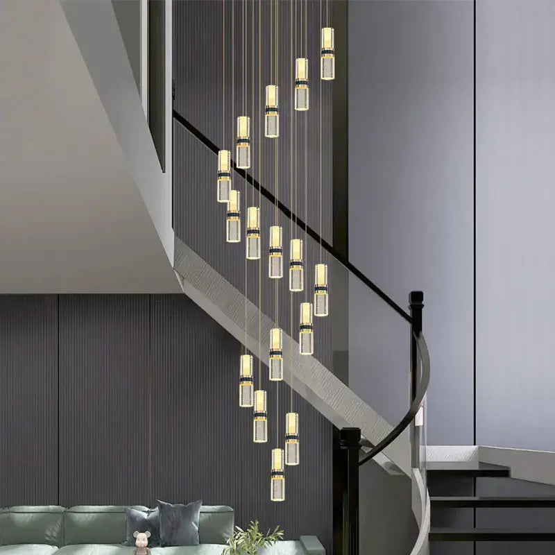 Modern crystal columnar chandelier stair lamp featuring clear glass cylinders and gold-toned metallic accents for decorbites