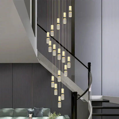 Modern crystal columnar chandelier stair lamp featuring clear glass cylinders and gold-toned metallic accents for decorbites