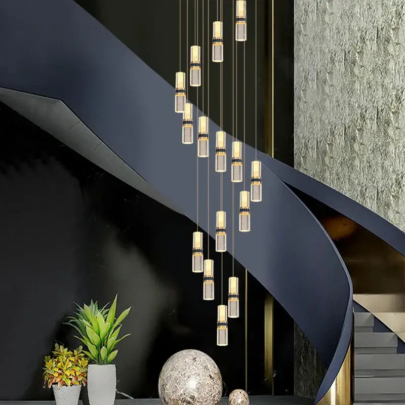 Modern crystal columnar chandelier with cascading cylindrical glass and metallic accents for stairwell lighting decorbites crystal columnar