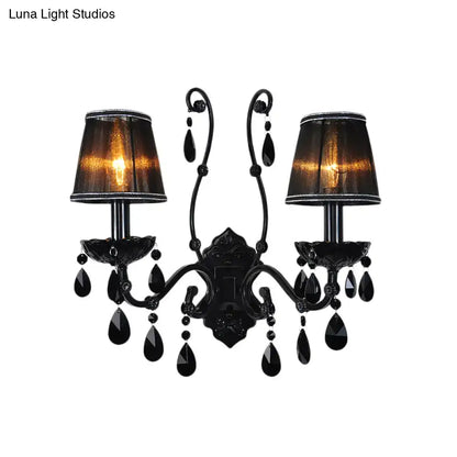 Black ornate modern crystal cone wall mount sconce with two lampshades and teardrop crystals for living room